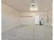 Clean, empty garage with a water heater and neutral colored walls, ready for storage at 7580 W Darrel Rd, Laveen, AZ 85339