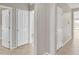 Bright hallway showcasing neutral walls and tiled flooring at 7580 W Darrel Rd, Laveen, AZ 85339