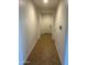 Bright hallway with tile flooring leading to the front door at 7580 W Darrel Rd, Laveen, AZ 85339