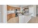 This kitchen features wood cabinetry, granite countertops, an island and stainless steel appliances at 7580 W Darrel Rd, Laveen, AZ 85339