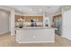 Spacious kitchen with a large island, stainless steel appliances, and warm cabinetry at 7580 W Darrel Rd, Laveen, AZ 85339
