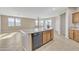 Open kitchen design features a granite island, wood cabinetry and stainless appliances at 7580 W Darrel Rd, Laveen, AZ 85339