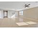 An expansive living room featuring an open floor plan and tile flooring at 7580 W Darrel Rd, Laveen, AZ 85339