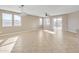 A spacious living room with tile flooring, recessed lighting and a ceiling fan at 7580 W Darrel Rd, Laveen, AZ 85339