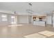 An open floor plan with tile flooring throughout the living room and kitchen at 7580 W Darrel Rd, Laveen, AZ 85339