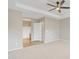 Main bedroom with neutral paint, carpet, a ceiling fan and ensuite bath at 7580 W Darrel Rd, Laveen, AZ 85339