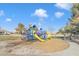 A cheerful playground with slides, climbing structures, and a soft landing surface at 7580 W Darrel Rd, Laveen, AZ 85339