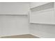 Walk-in closet provides ample storage with built-in shelving and rods, enhancing organization and convenience at 7580 W Darrel Rd, Laveen, AZ 85339