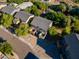 Birds eye of community homes and streets surrounded by natural greenery and foliage at 827 E Pecan Rd, Phoenix, AZ 85040