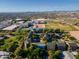 A landscape view that presents homes, tennis courts, buildings, trees, and Phoenix cityscape at 827 E Pecan Rd, Phoenix, AZ 85040