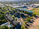 Aerial shot showing community homes near tennis courts and lush natural greenery at 827 E Pecan Rd, Phoenix, AZ 85040