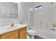 Well-lit bathroom with a tub/shower combo, a single sink vanity, and a window at 827 E Pecan Rd, Phoenix, AZ 85040