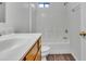 Bright bathroom featuring a vanity, toilet, and shower/tub combination at 827 E Pecan Rd, Phoenix, AZ 85040