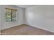 Bedroom with beige carpet and a window with blinds at 827 E Pecan Rd, Phoenix, AZ 85040