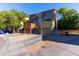 View of modern townhomes with front-facing garages and contemporary color schemes at 827 E Pecan Rd, Phoenix, AZ 85040