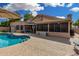 Beautiful backyard featuring a pool, covered patio, and comfortable outdoor seating at 9004 S Ash Ave, Tempe, AZ 85284