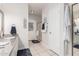 Bright bathroom with granite vanity, tile floor, shower, and exterior door, offering convenience and style at 9004 S Ash Ave, Tempe, AZ 85284