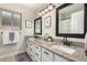 Bathroom with double sinks, framed mirrors, updated fixtures and great lighting at 9004 S Ash Ave, Tempe, AZ 85284