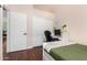 Well-lit bedroom with a desk, chair, bed, and closet at 9004 S Ash Ave, Tempe, AZ 85284