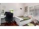 Bright bedroom with a desk, chair, bed, and plenty of natural light at 9004 S Ash Ave, Tempe, AZ 85284