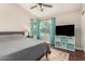 Bedroom featuring a comfortable bed, ceiling fan, and a closet at 9004 S Ash Ave, Tempe, AZ 85284
