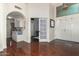 Open foyer with beautiful hardwood floors, white trim, and views into the kitchen and living areas at 9004 S Ash Ave, Tempe, AZ 85284