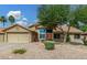 Charming single-Gathering home with a spacious two-car garage, desert landscaping, and a beautiful tree in the front yard at 9004 S Ash Ave, Tempe, AZ 85284