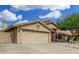 Single-Gathering home with a large two-car garage, desert landscaping, and a charming front entrance at 9004 S Ash Ave, Tempe, AZ 85284