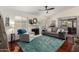 Inviting living room with fireplace, hardwood floors, and a comfortable seating area with lots of light at 9004 S Ash Ave, Tempe, AZ 85284