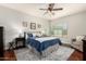 Comfortable main bedroom with a ceiling fan, nice carpet and a plush armchair at 9004 S Ash Ave, Tempe, AZ 85284