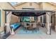 Relax in this cozy outdoor seating area under a gazebo with comfortable cushions at 9004 S Ash Ave, Tempe, AZ 85284