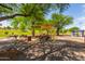 Outdoor picnic area has tables, shade structures, and a barbeque perfect for community gatherings at 9004 S Ash Ave, Tempe, AZ 85284