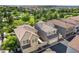 Aerial view highlighting the well-planned community with tree-lined streets, garages, and inviting landscaping at 970 S Henry Ln, Gilbert, AZ 85296