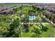 Aerial view showcasing the community pool, lush landscaping, and walking paths, offering a resort-style living experience at 970 S Henry Ln, Gilbert, AZ 85296