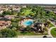 Overhead community view of the pool surrounded by tall palms, sun umbrellas, and grassy recreation area at 970 S Henry Ln, Gilbert, AZ 85296