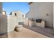 Private backyard with pavers, built-in BBQ, and stylish fencing for outdoor relaxation and entertaining at 970 S Henry Ln, Gilbert, AZ 85296