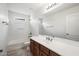 Well-lit bathroom featuring a vanity, tub/shower and a large mirror at 970 S Henry Ln, Gilbert, AZ 85296