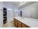 Well-lit bathroom featuring a large mirror, and shower-tub combo at 970 S Henry Ln, Gilbert, AZ 85296