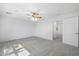 Spacious, bright bedroom with fan, neutral carpet and ample natural light at 970 S Henry Ln, Gilbert, AZ 85296