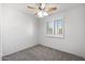 Bedroom with a ceiling fan, window, and neutral carpet at 970 S Henry Ln, Gilbert, AZ 85296