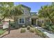 Charming home featuring stone accents, a covered porch, and a well-manicured front yard at 970 S Henry Ln, Gilbert, AZ 85296