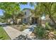 Charming two-story home featuring a stone facade, manicured landscaping, and inviting entrance at 970 S Henry Ln, Gilbert, AZ 85296