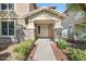 Inviting front porch with stone accents, manicured landscaping, and a welcoming entrance at 970 S Henry Ln, Gilbert, AZ 85296