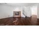 Open living room featuring a stone fireplace and hardwood flooring at 970 S Henry Ln, Gilbert, AZ 85296