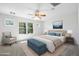 Inviting bedroom with a large window providing ample natural light and a ceiling fan at 970 S Henry Ln, Gilbert, AZ 85296