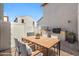 Cozy patio featuring a wooden dining table set and built-in grill perfect for outdoor entertaining at 970 S Henry Ln, Gilbert, AZ 85296