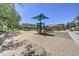 Community playground area featuring a slide, swings, and benches at 970 S Henry Ln, Gilbert, AZ 85296