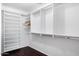 Walk-in closet featuring custom shelving and hanging rods, maximizing storage and organization at 970 S Henry Ln, Gilbert, AZ 85296