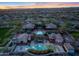 Aerial view of the community center showcasing its pools, outdoor spaces, and lush landscaping at 9845 E Edgestone Dr, Scottsdale, AZ 85255
