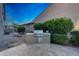 Outdoor kitchen with stainless steel grill, green landscaping, and a hammock at 9845 E Edgestone Dr, Scottsdale, AZ 85255